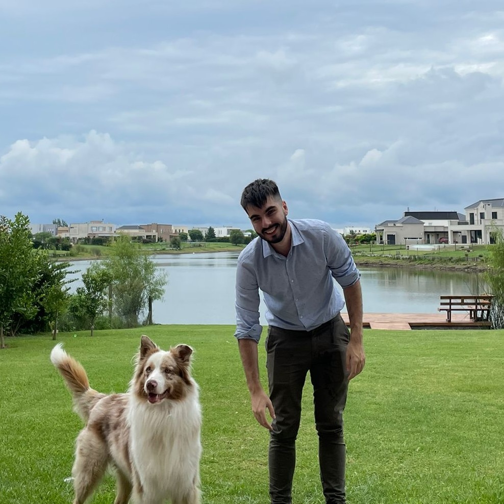headshot image of Bautista Bambozzi with his dog